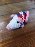 crocheted red white and blue possums